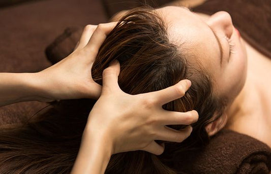 How does our scalp massage promote hair growth?